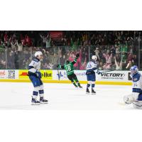 Texas Stars' Kyle Capobianco and Colorado Eagles' Wyatt Aamodt, Jere Innala, and Adam Scheel on the ice