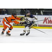 Moorhead High School defenseman Brandon Mickelson (left)