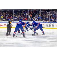 Syracuse Crunch forward Jack Finley faces off with the Rochester Americans