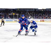 Syracuse Crunch defenseman Maxim Groshev (right) vs. the Rochester Americans