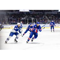 Syracuse Crunch center Dylan Duke (left) vs. the Rochester Americans